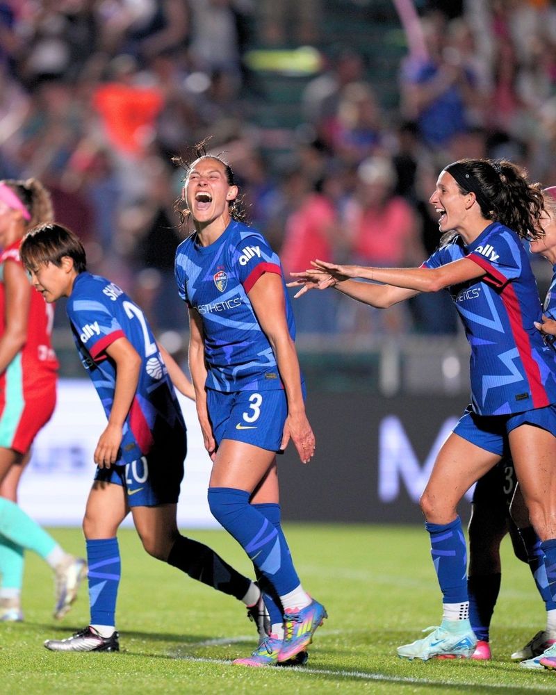 Kaleigh Kurtz and Ryan Williams celebrate after KK's goal