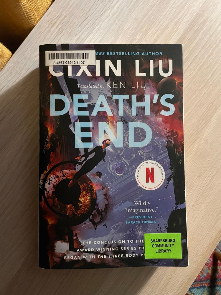 Death’s End by Cixin Liu rests on top of a shelf. 