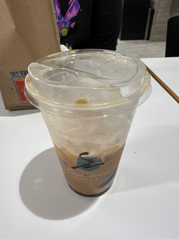 Photo of a half-empty iced mocha espresso from Caribou Coffee.