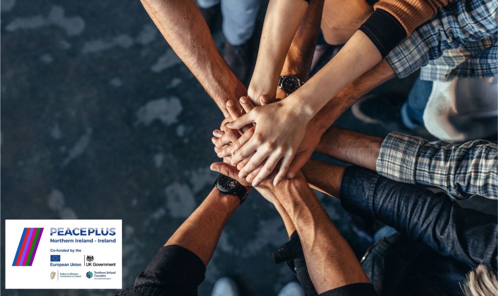 Stock image of a group of people joining hands, with PEACEPLUS logo pictured in inset