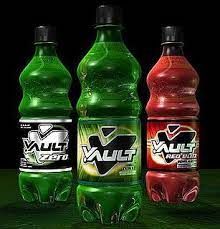 Three soda bottles, each with a large "V" on the front. The left and center ones are green, and the far right one is red
