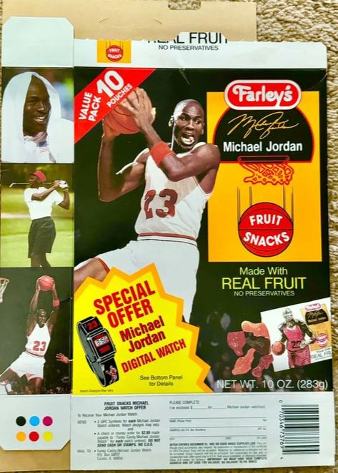 The back of a fruit snacks box, with a variety of images of Michael Jordan, including him golfing, doing an interview with a towel on his head, and grabbing rebounds. The jersey he is wearing is white and red, with his number 23, but with all Bulls or NBA logos removed. There is also an ad to send away for a special Michael Jordan digital watch