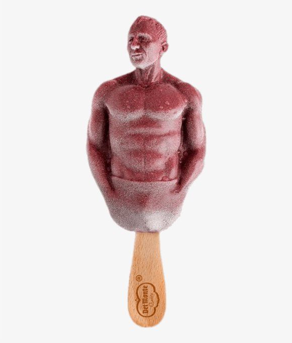 A popsicle molded into the shirtless torso and head of Daniel Craig, with a Del Monte popsicle stick on the bottom