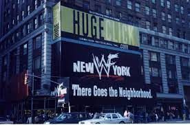 A sign for WWF New York on the side of a building in NYC, with the tagline, "There Goes the Neighborhood." 