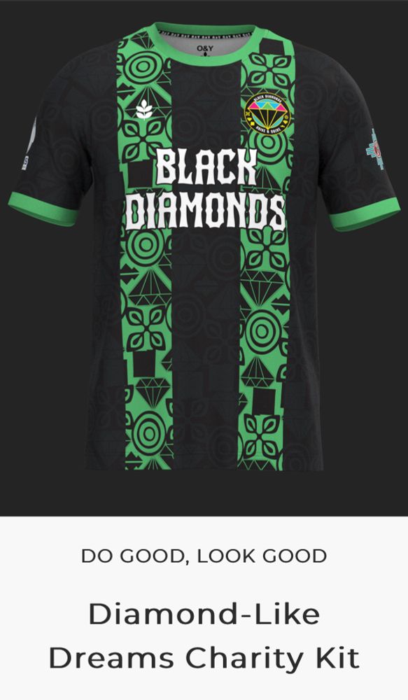 Caption: DO GOOD, LOOK GOOD
Diamond-Like Dreams Charity

A black soccer/football shirt with green trim. Chest says Black Diamonds and has the groups crest.