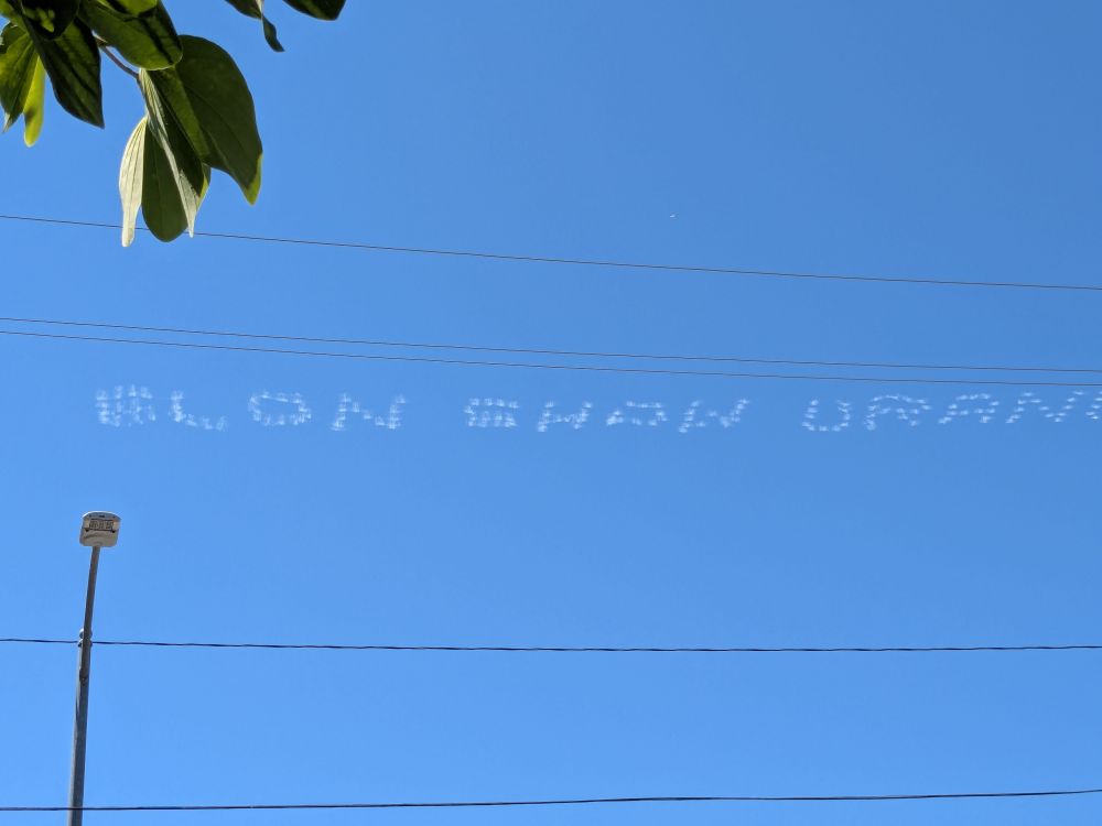 Elon Show Uranus written across the sky 