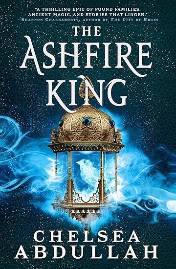 a black background dotted with stars, the central part filled with a swirling blue cloud of fire. Over the fire is an ornate pagoda-like structure with a gold and inscribed dome with jeweled stars. Inside the structure the blue swirls form the shape of a bird. The title is above the dome: The Ashfire King, while the author's name is below the structure's floor: "Chelsea Abdullah"