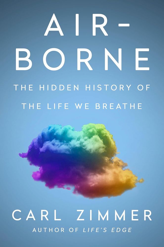 against a light blue/sky-colored background, a group of multi-colored clouds — blue, green, yellow, pink — hover. The title and subtitle  are centered above the clouds (Air-Borne: The Hidden History of The Life We Breathe) and the author is centered below (Carl Zimmer Author of Life's Edge")
