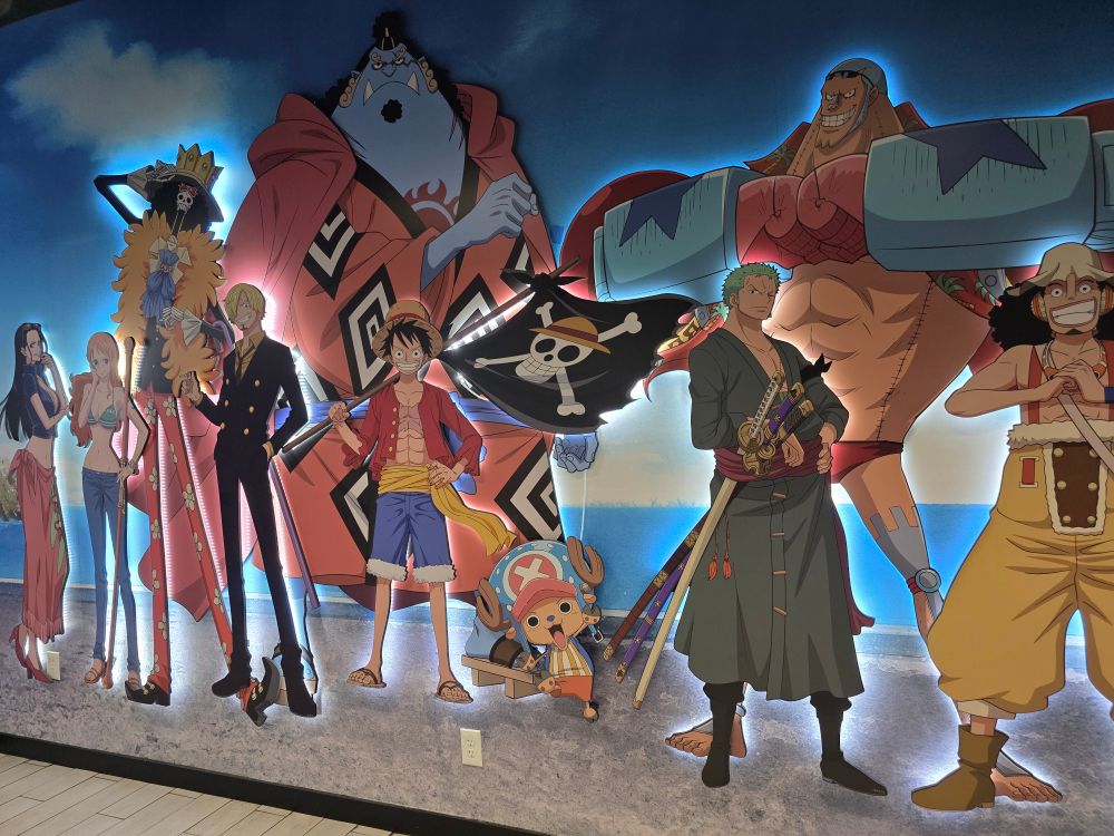 Cut outs of the Straw Hat Pirates with LEDs behind them