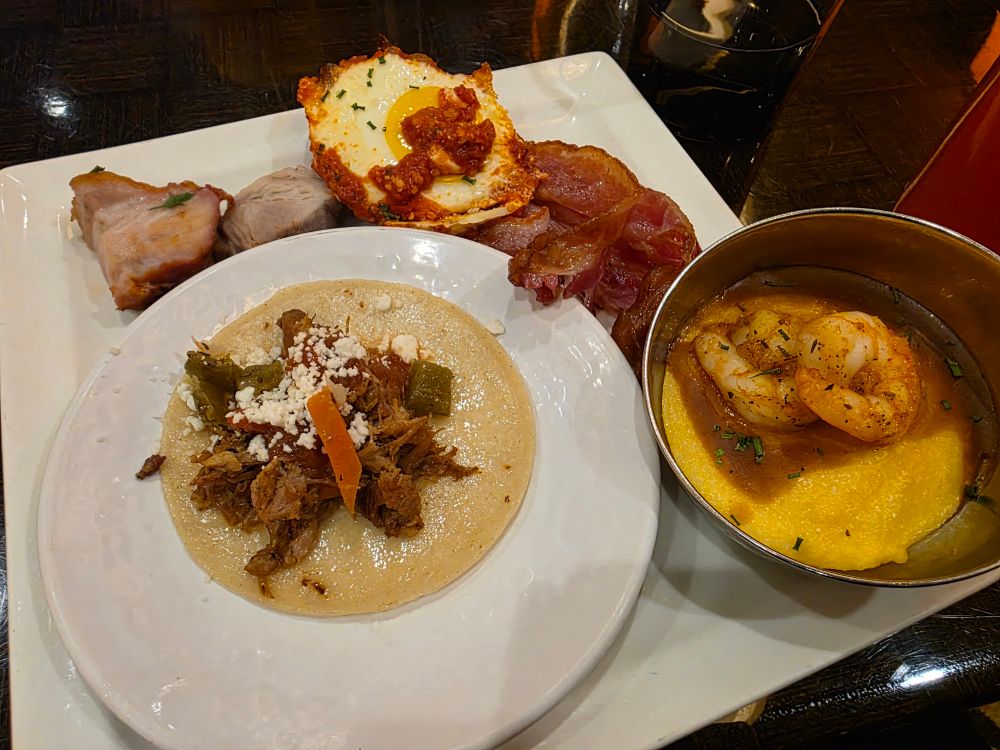 Pork, bacon, shakshuka, and two other dishes I'm forgetting the names of