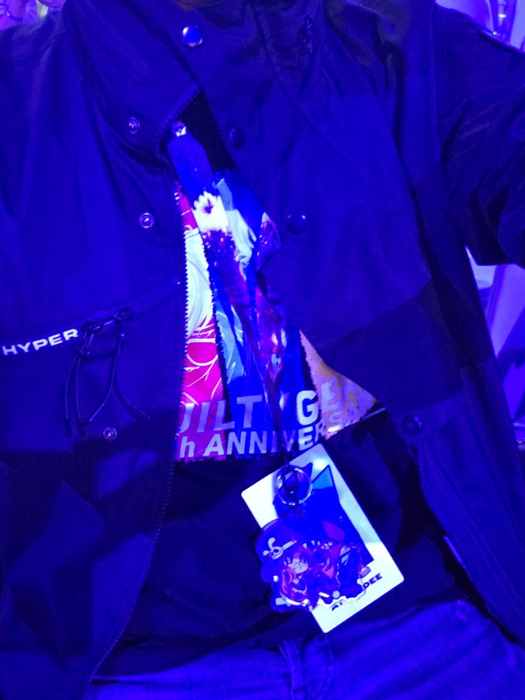 M.RAGE jacket with a 20th Anni Guilty Gear shirt and lanyard that is docrated in various charms 