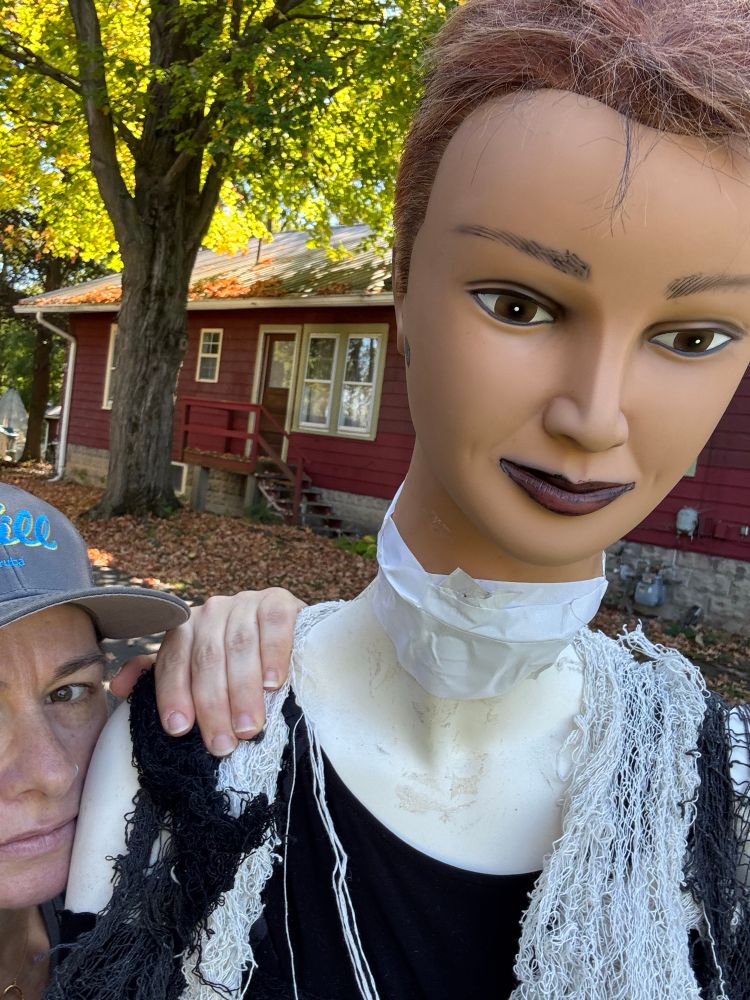 Woman with a mannequin for Halloween 