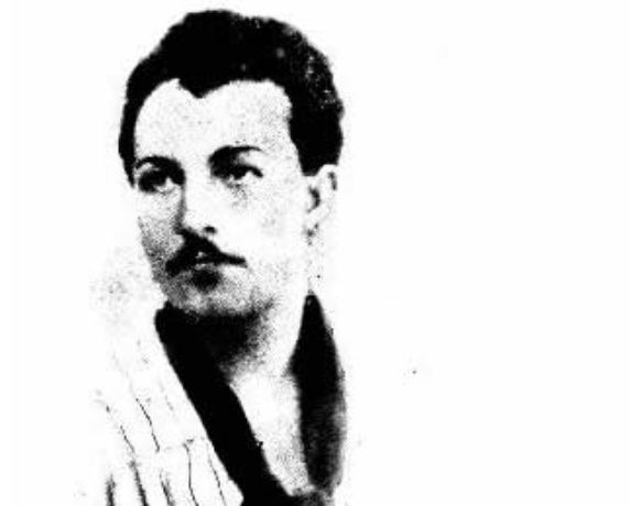 Portrait von Passannante. Er trägt einen schmalen Oberlippenbart und einen schwarzen Schal.