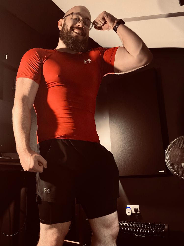 Kit flexes in his studio.