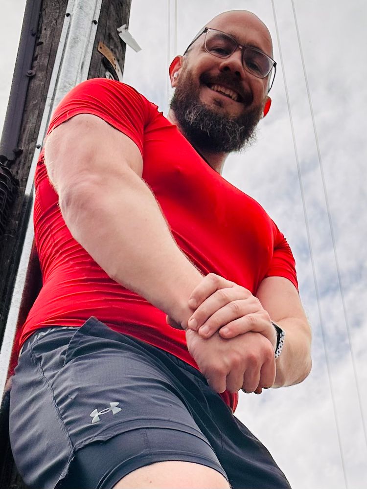Kit smiles in his gym gear.