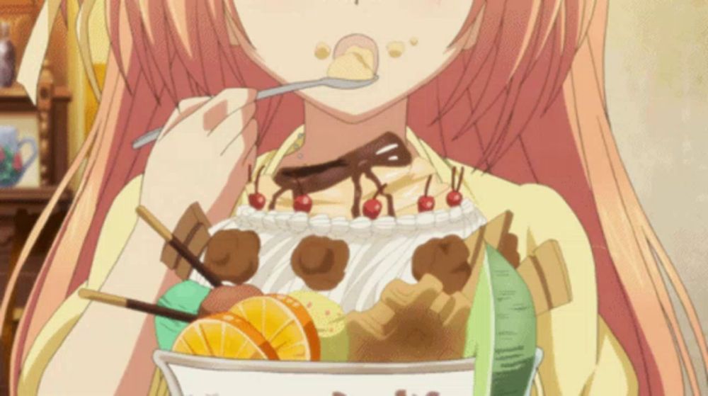 a girl with pink hair is eating a dessert with a spoon in her mouth