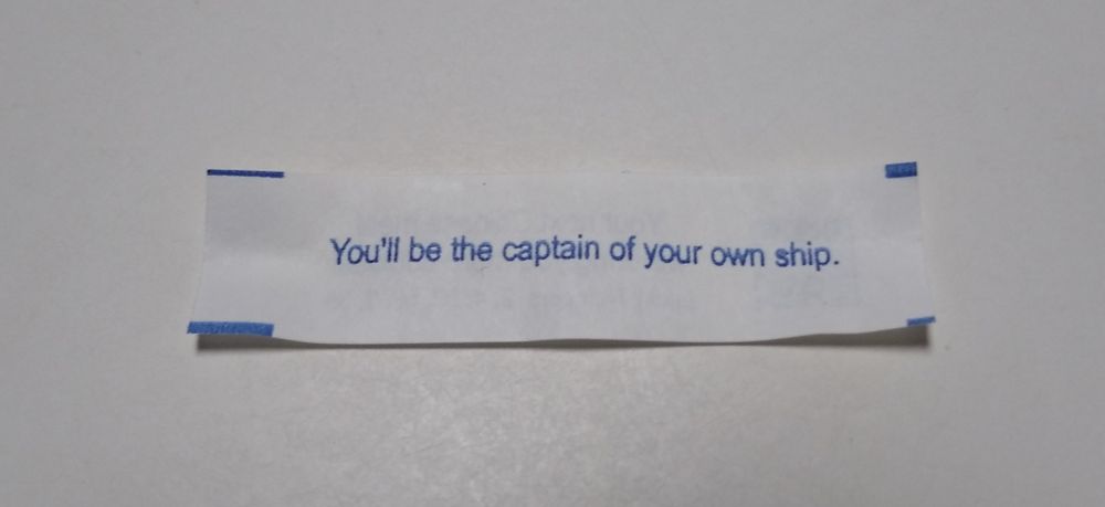 A fortune cookie fortune that reads "You'll be the captain of your own ship."