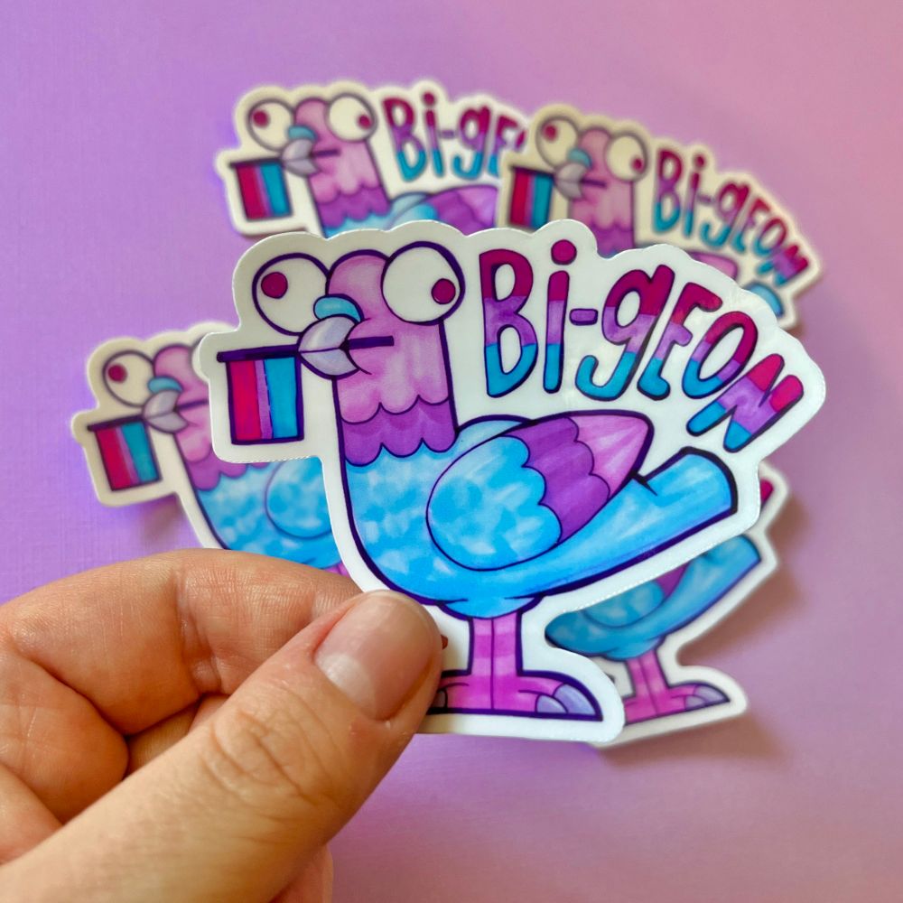 A sticker of a silly looking pigeon holding a bisexual pride flag with the text "bi-geon"
