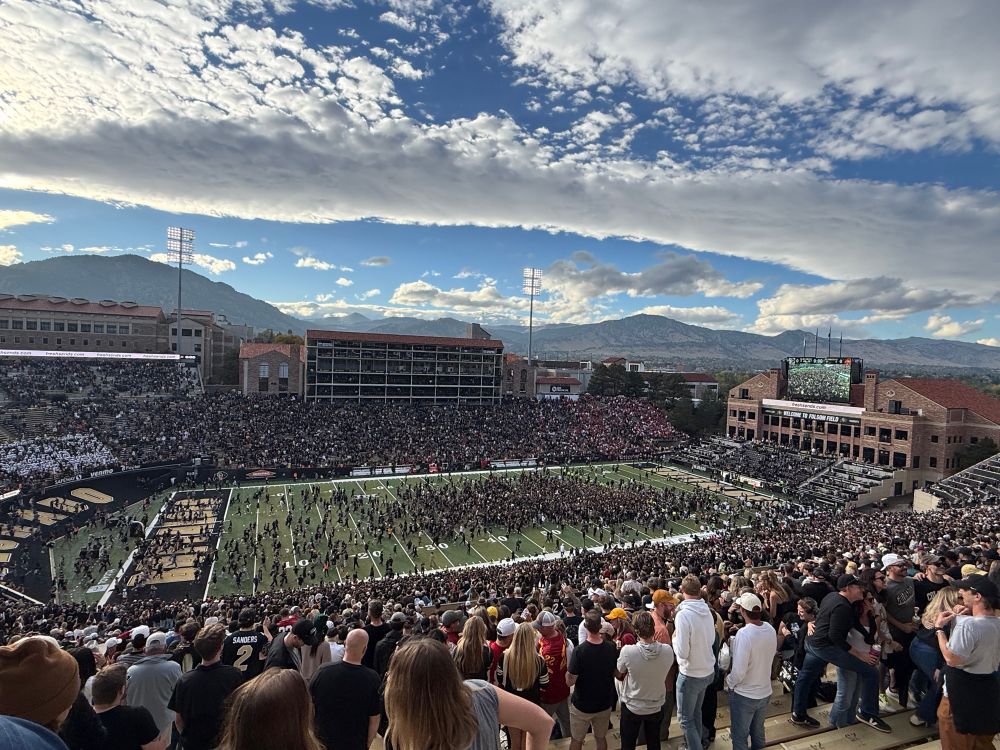 students storm the field after a Buffs upset win!