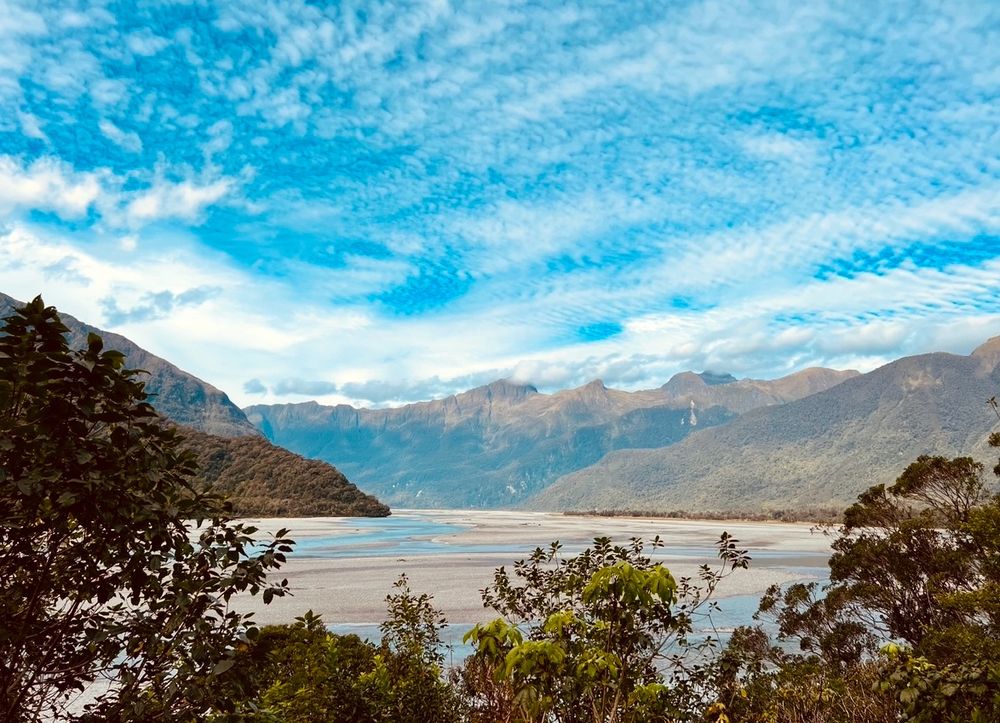 Looking down onto a river winding through mountains 