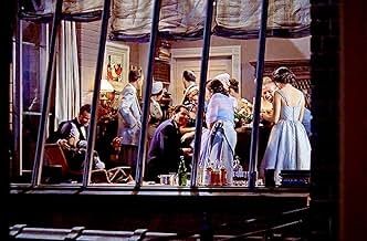 A big party scene, as seen through the window of an apartment in a scene from the film REAR WINDOW (1954)