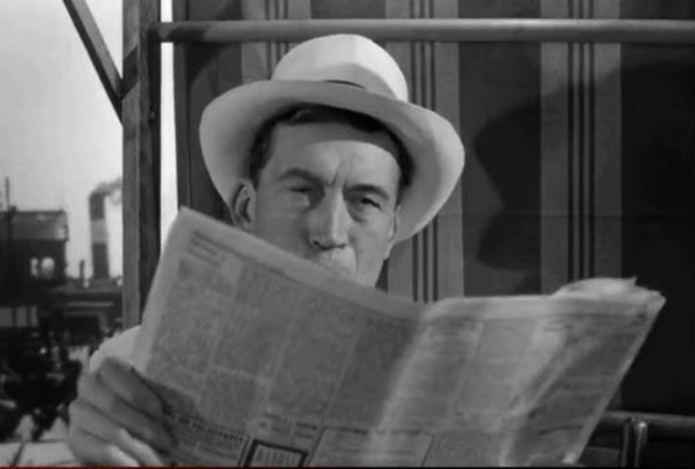 A black and white image of a man wearing a white fedora hat, while holding a newspaper in front of his face, leaving only his eyes and nose visible over the top of the newspaper.

John Huston, born on this day in 1906 (d. 1987) in a scene from the film THE TREASURE OF THE SIERRA MADRE (1948)

Tags
films movies cinema classic hollywood legend happy birthday botd actor director bogart