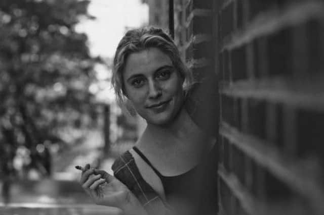A black and white image of a young woman with short hair, leaning out of an apartment window, holding a cigarette in one hand.
She's looking at the camera with a slight smile on her face.
Greta Gerwig, born on this day in 1983, as Frances Halladay in a scene from the film FRANCES HA (2012)

Tags
Filmsky moviesky MOVIES films botd happy birthday Hollywood legend actress comedy drama 
