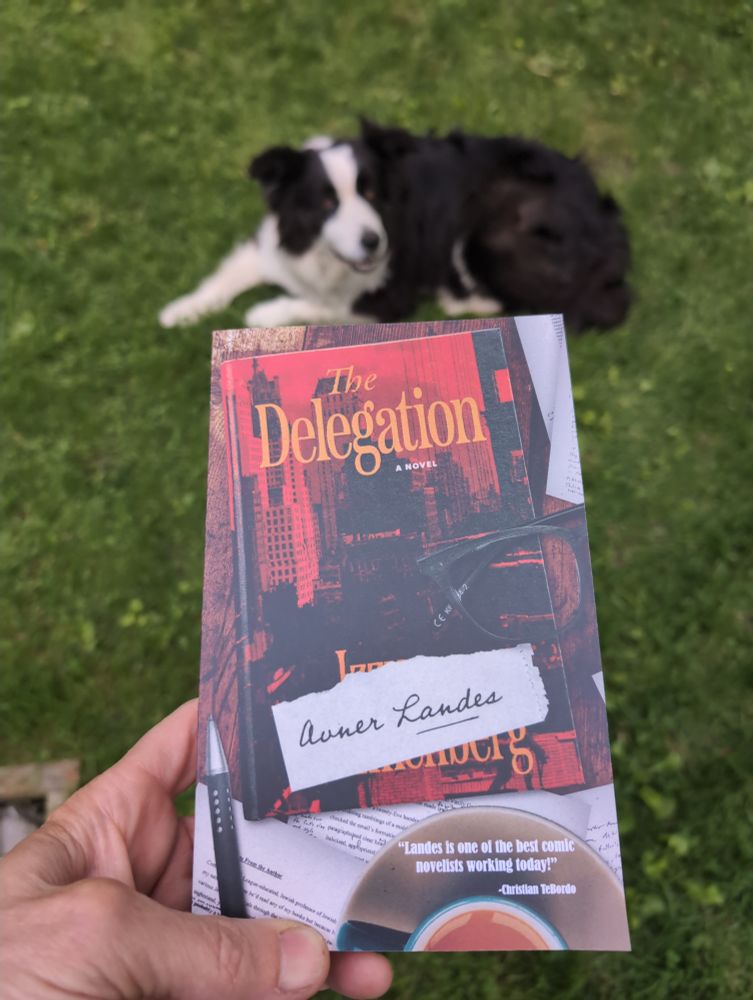 Foreground: The delegation by Aner Landness front cover
Background: incorrigibly, deviously sweet border collie, Joy