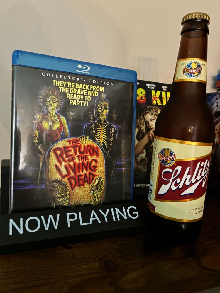 Return of the Living Dead Blu-ray case posed next to a bottle of Schlitz beer.