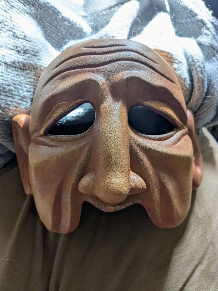 A half face neoprene theater mask called the grandfather.