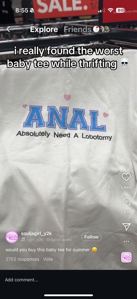 a screenshot from instagram from a video of someone thrift shopping. they come across a shirt that reads 🩷ANAL🩷 Absolutely Need A Lobotomy