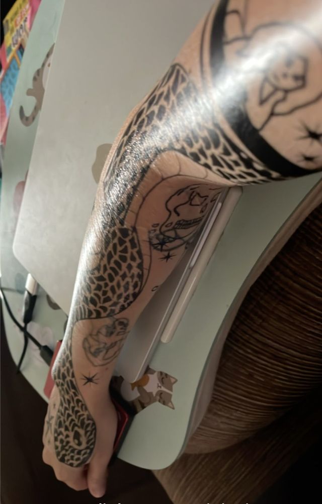 my arm covered in ed’s tattoos