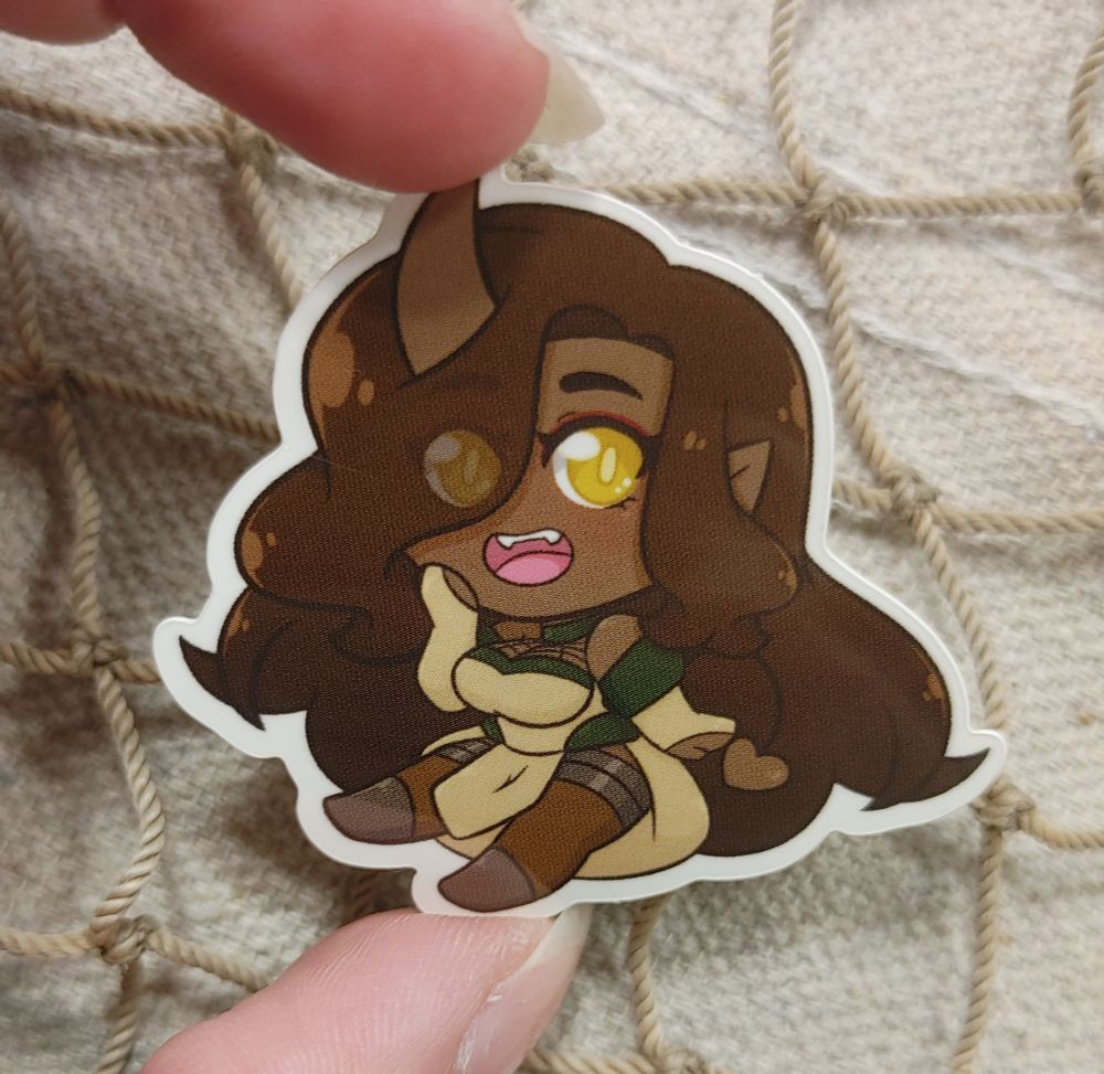 Sticker of Sempa Athol, Tiefling with long brown hair, covering one eye and one horn.