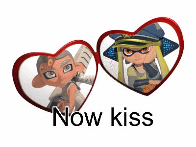 a couple of hearts with the words " now kiss " on the bottom