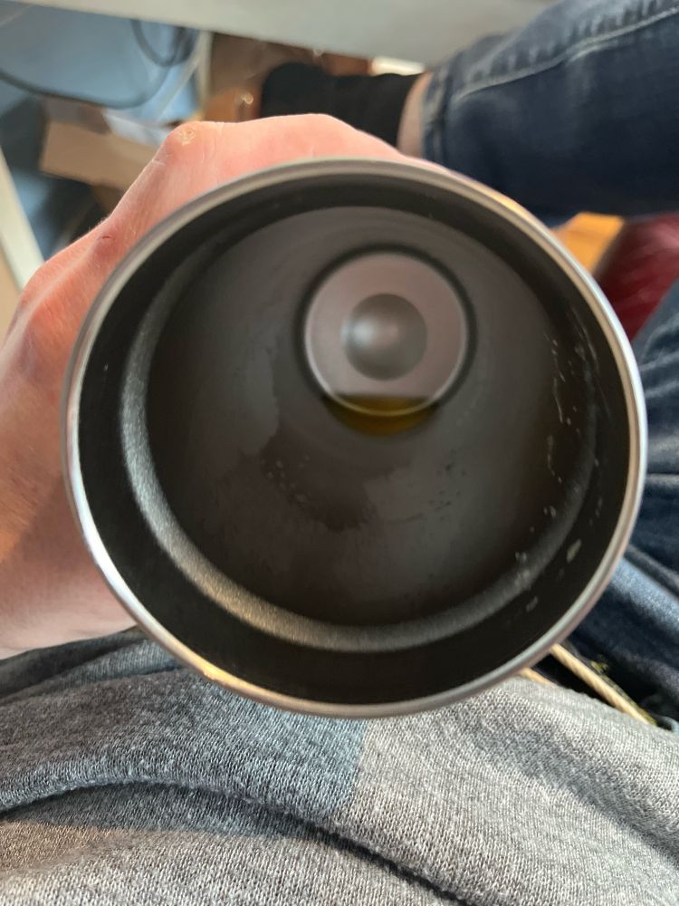 The drippings of a beer-looking beverage