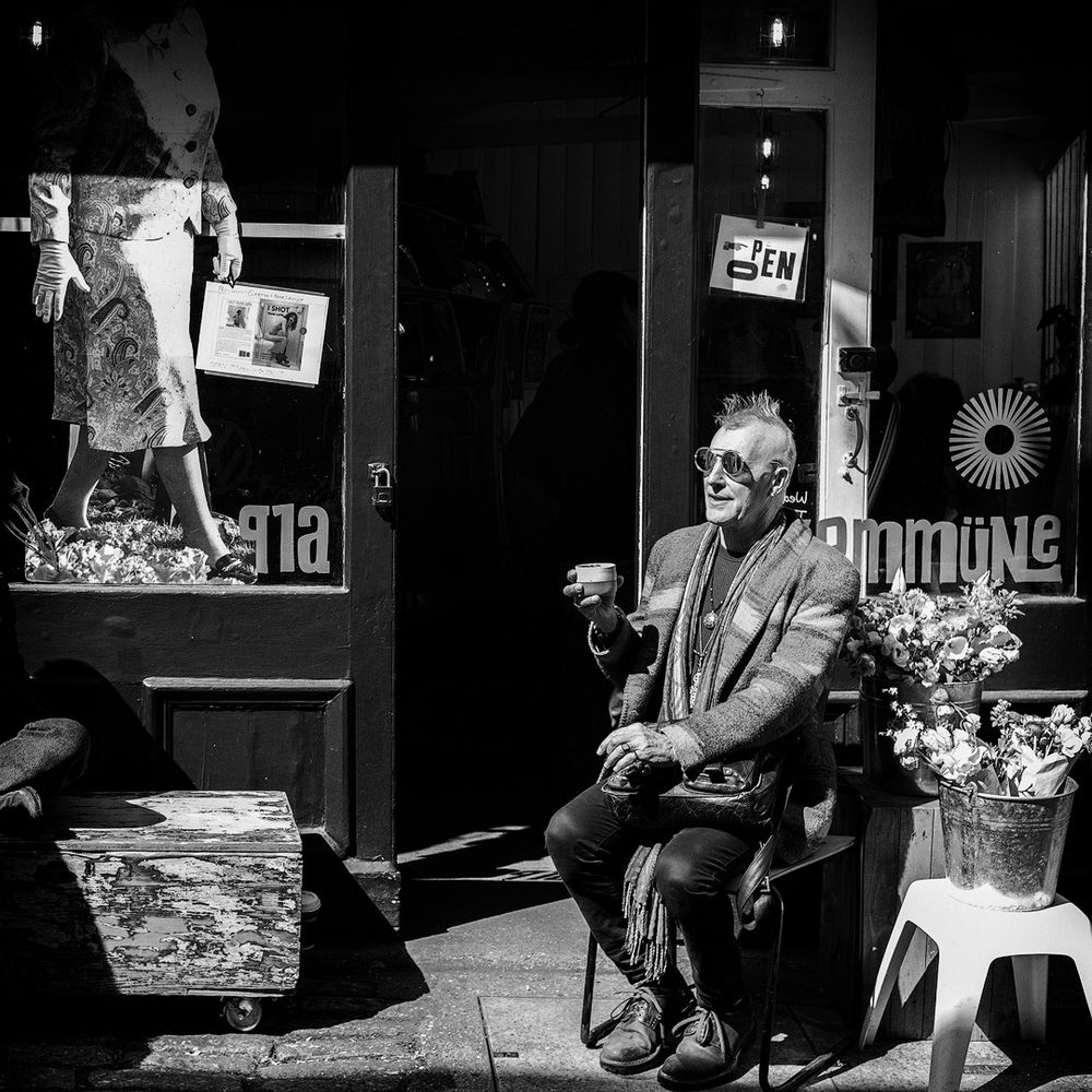 Eclectic black and white photo of a coffee house.