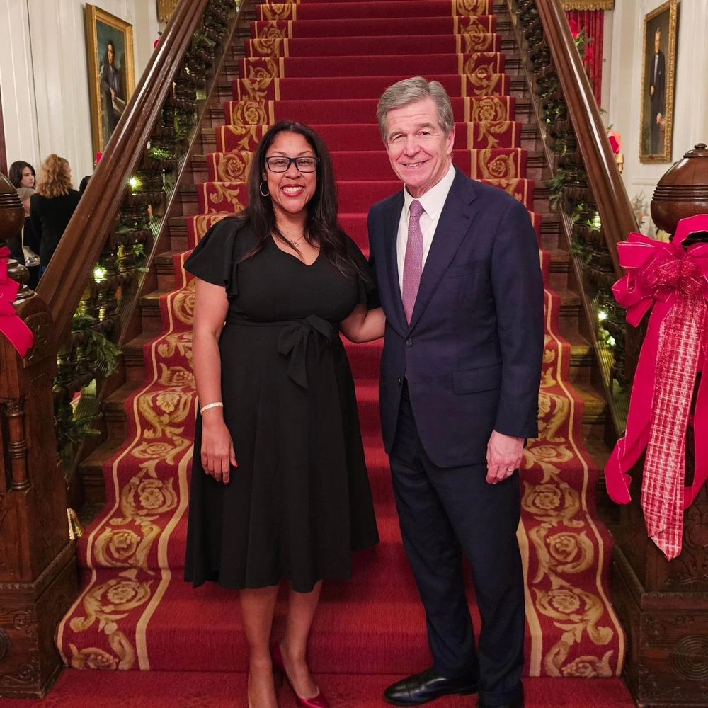 Picture of Governor Roy Cooper and Kimberly Hardy standing together in the North Carolina Governor's mansion. 