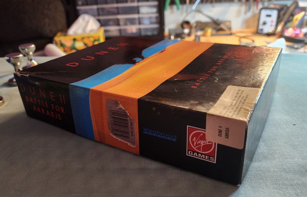The box for the game Dune II, now less caved in after using the hot plate method