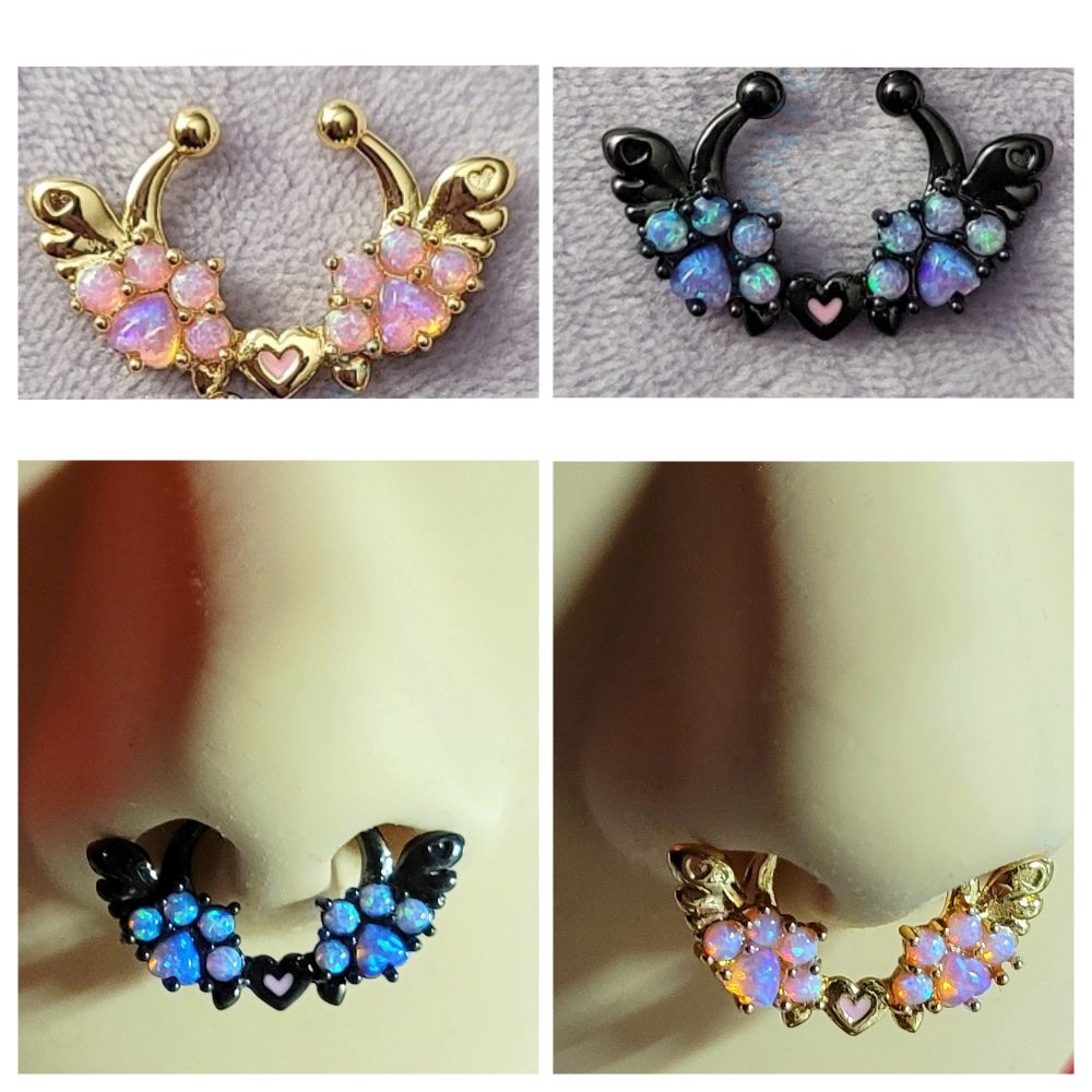Image shows a collage of photos of clip-on septum rings with a design of 2 angel wings, 2 paws made of lab opals between them, and a heart with pink enamel in the very center. There is a black example which is gunmetal, plated, and a gold example which is 18k gold plated. They are completely hypoallergenic: NO nickel, lead, or cadmium in plating or the base metal (brass). 