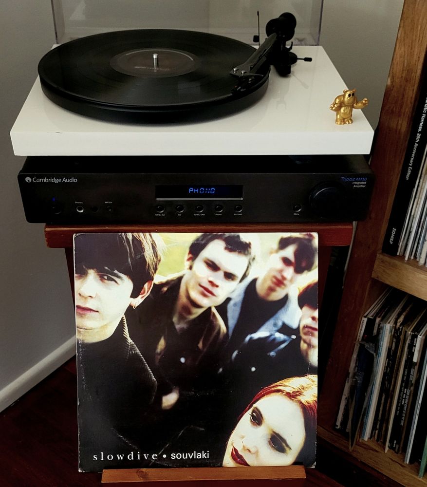 Vinyl record on turntable, cover displayed. 
Artist: Slowdive 
Album: Souvlaki 