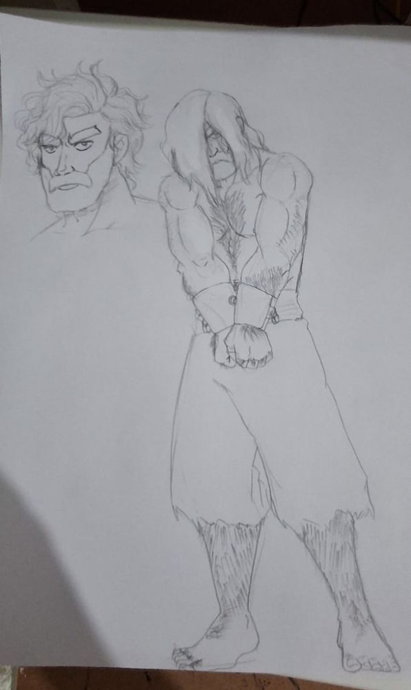 Na imagem tem um desenho de um homem acorrentado pelas mãos. Seus cabelos escondem seu rosto, com exceção de seu olho esquerdo, que olha diretamente para frente. Possui uma barba espessa. Está só com uma calça esfarrapada. Seu corpo é musculoso e peludo.
Ao lado dele está desenhando seu rosto em meio perfil, mostrando como ele realmente é: de rosto comprido, barba espessa e bem desenhada, sobrancelhas grossas e cabelos ondulados bem penteados para o lado direito. Seu rosto está sério e olhando para frente. 