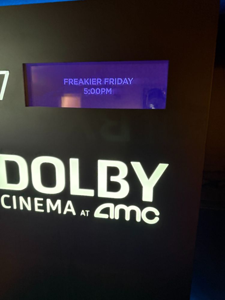 The Dolby Cinema sign outside of the theater showing Freakier Friday playing at 5pm