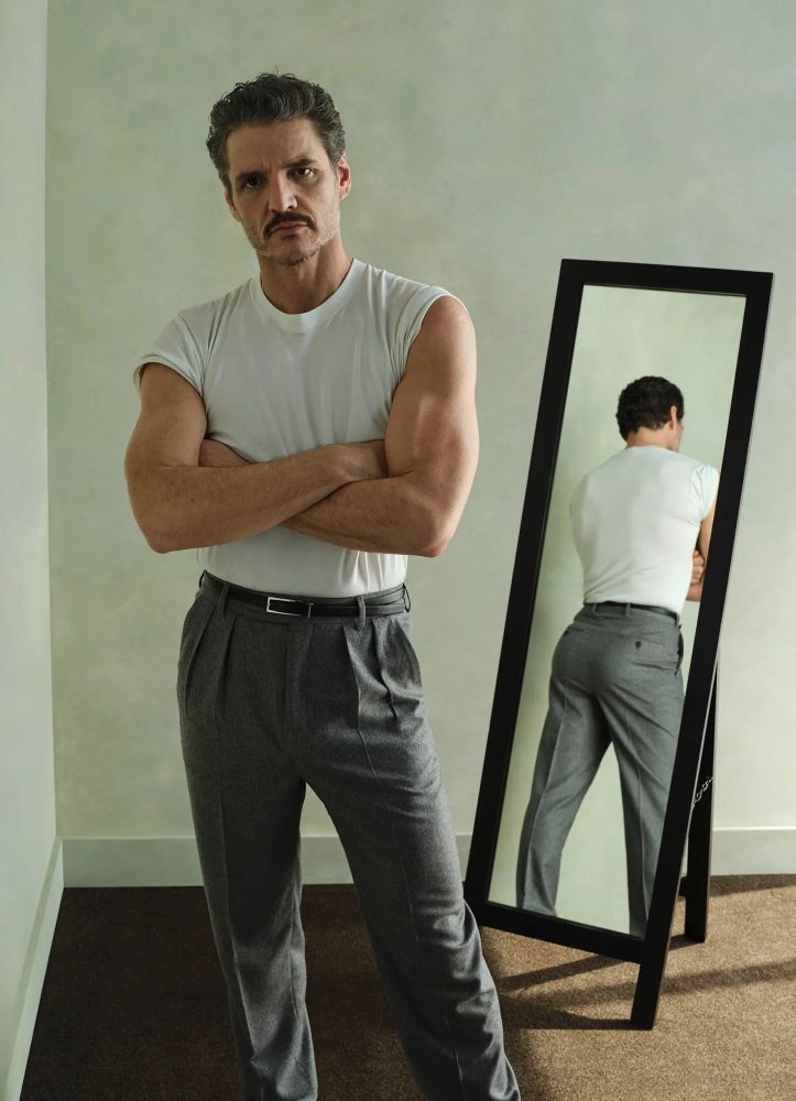 Pedro Pascal, standing in front of a mirror. Looking fine. 
