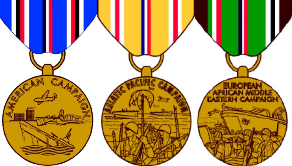 Three US military decorations, left The American Campaign Medal, shows a Navy cruiser underway with a B-24 Liberator bomber flying overhead. In the foreground is a sinking enemy submarine, and in the background is the skyline of a city, the ribbon is oriental blue in the center is stripe divided into thirds of old glory blue, white, and scarlet. Between the center and the edges are stripes of white, black, scarlet and white.
Center the Asiatic–Pacific Campaign Medal, It depicts a sailor (left) and a marine (right) in full combat gear, holding rifles. A beach with shattered palm tree trunks can be seen behind them, with a long palm tree still standing. In the water beyond the beach are an aircraft carrier (left) and a submarine (right). An airplane is visible over the sub. The ribbon is gold in the center is stripe divided into thirds of blue, white, and red. Between the center and the edges are stripes of red and white.
Right is the European–African–Middle Eastern Campaign Medal pictured is a LST landing craft and troops landing under fire with an airplane in the background. The ribbon is:
Brown 67136 which represents the sands of Africa; plus
1.6 mm each of Irish Green, White and Scarlet, representing Italy;
6.4 mm Irish Green represents the green fields of Europe;
1.1 mm each of Blue, White and red, which refers to the continuance of American Defense after Pearl Harbor;
6.4 mm Irish Green, again representing the green fields of Europe;
1.6 mm each White, Black, and White representing Germany;


