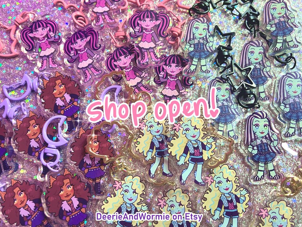 a photo of a pile of monster high keychains with text that says "shop open!" and "DeerieAndWormie on Etsy"