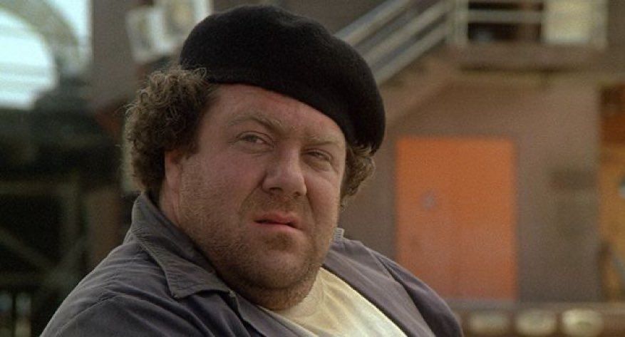 George Wendt as Fat Sam in Fletch (1985)