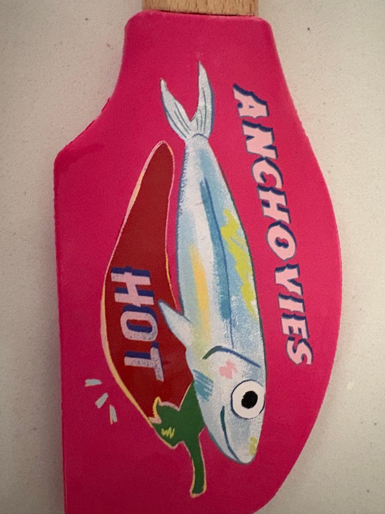 closeup of ANCHOVIES HOT spatula