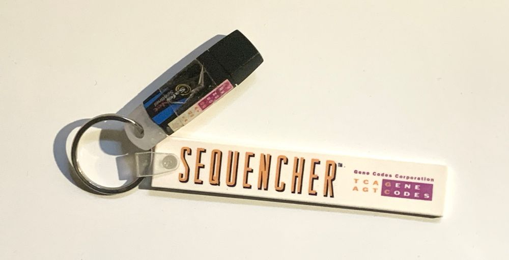 A USB stick attached to a keychain that says, “Sequencher Gene Codes Corporation“