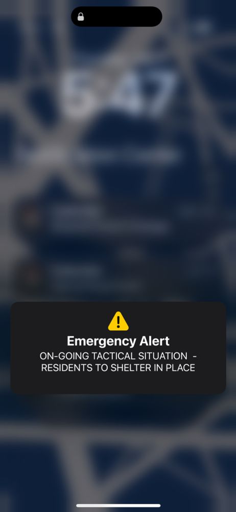 Screen shot of a phone with an alert that says, “Emergency Alert
ON-GOING TACTICAL SITUATION - RESIDENTS TO SHELTER IN PLACE”