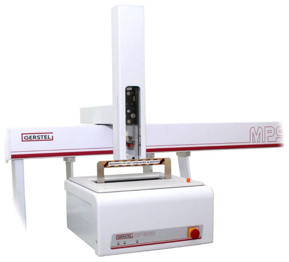 GERSTEL Centrifige (white box with red stripe) mounted on the rail of an xyz Multi Purpose Sampler